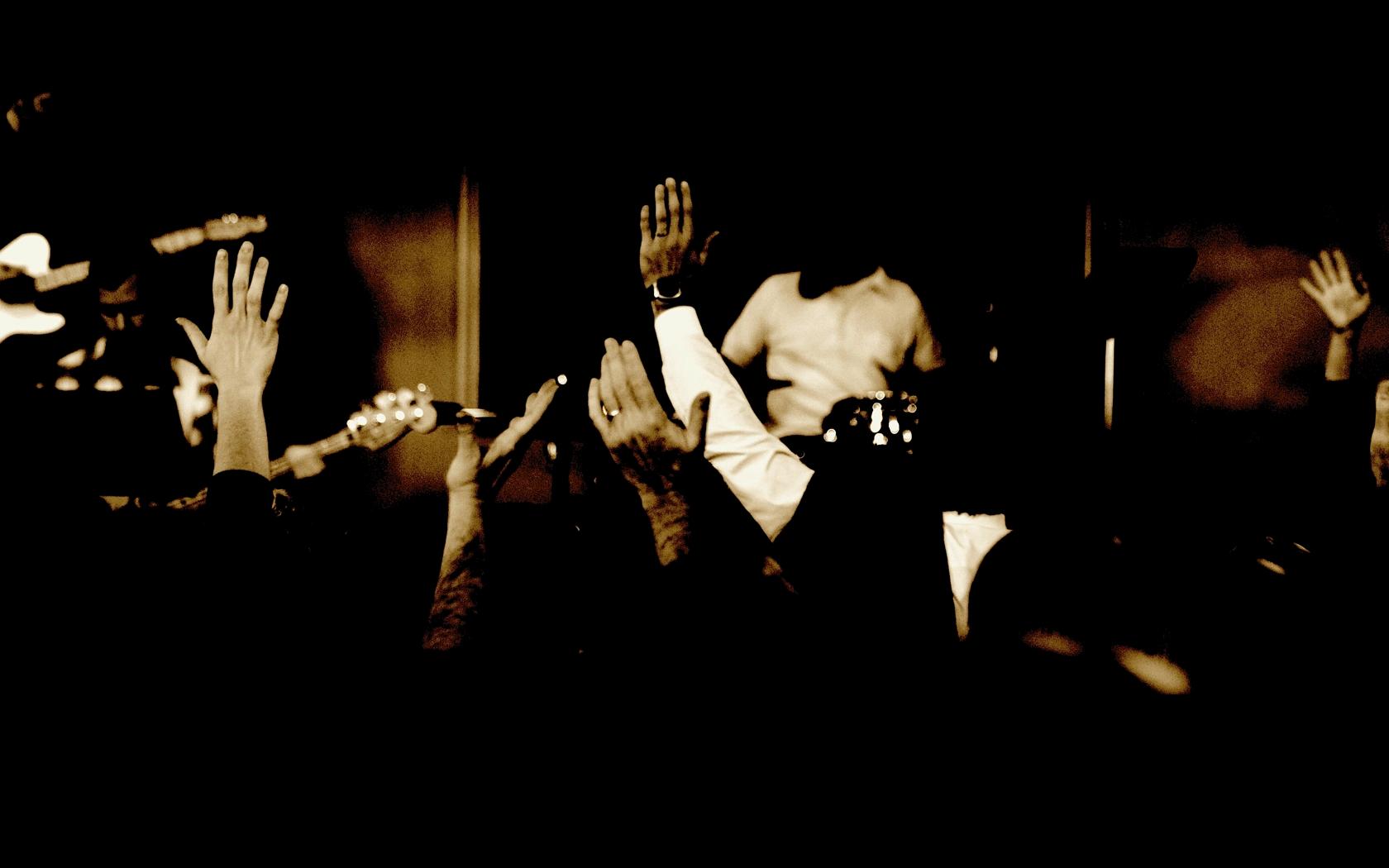 Hands_raised_church_worship_background