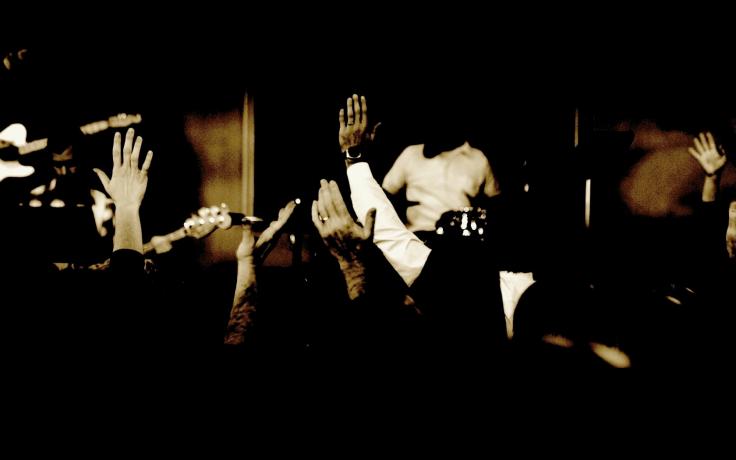 Hands_raised_church_worship_background
